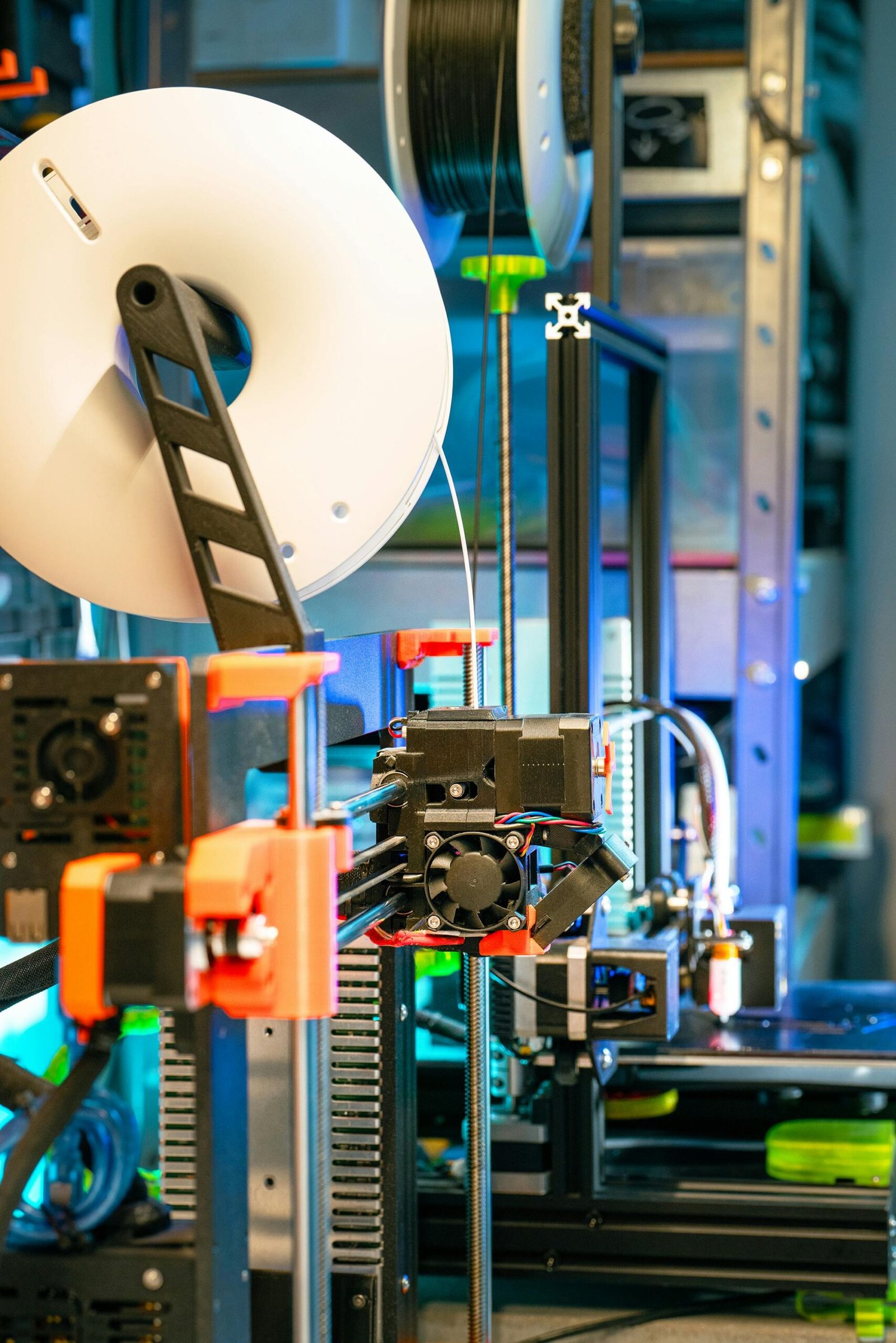 3DGigs Seattle 3D Printers collaborating on a project with a 3D model and laptop, showcasing design services and community interaction