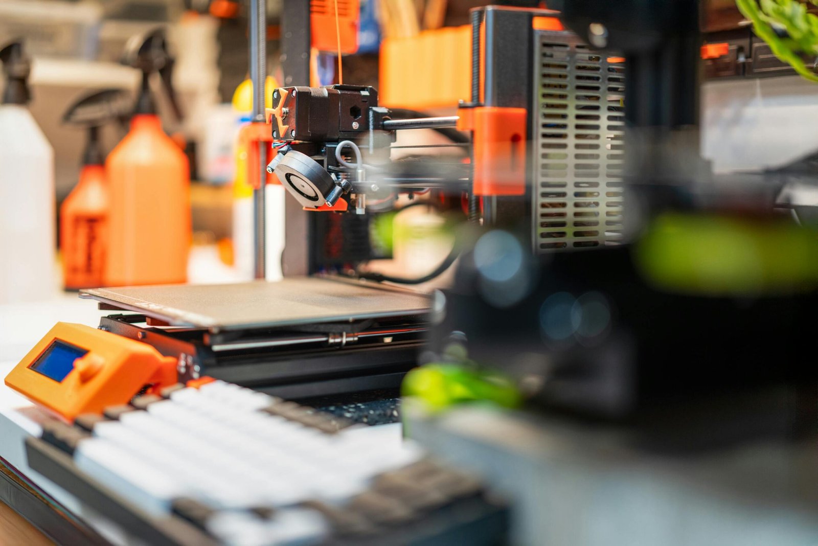 A person operating a 3D printer, demonstrating how fun is 3d printing.