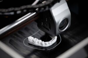 Expert 3D printing service provider working on a custom dental prototype