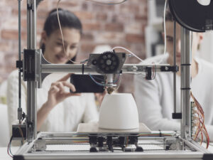 Freelance 3D printing service provider setting up a 3D printer