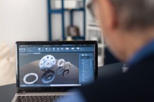 Custom manufacturing expert reviewing 3D model